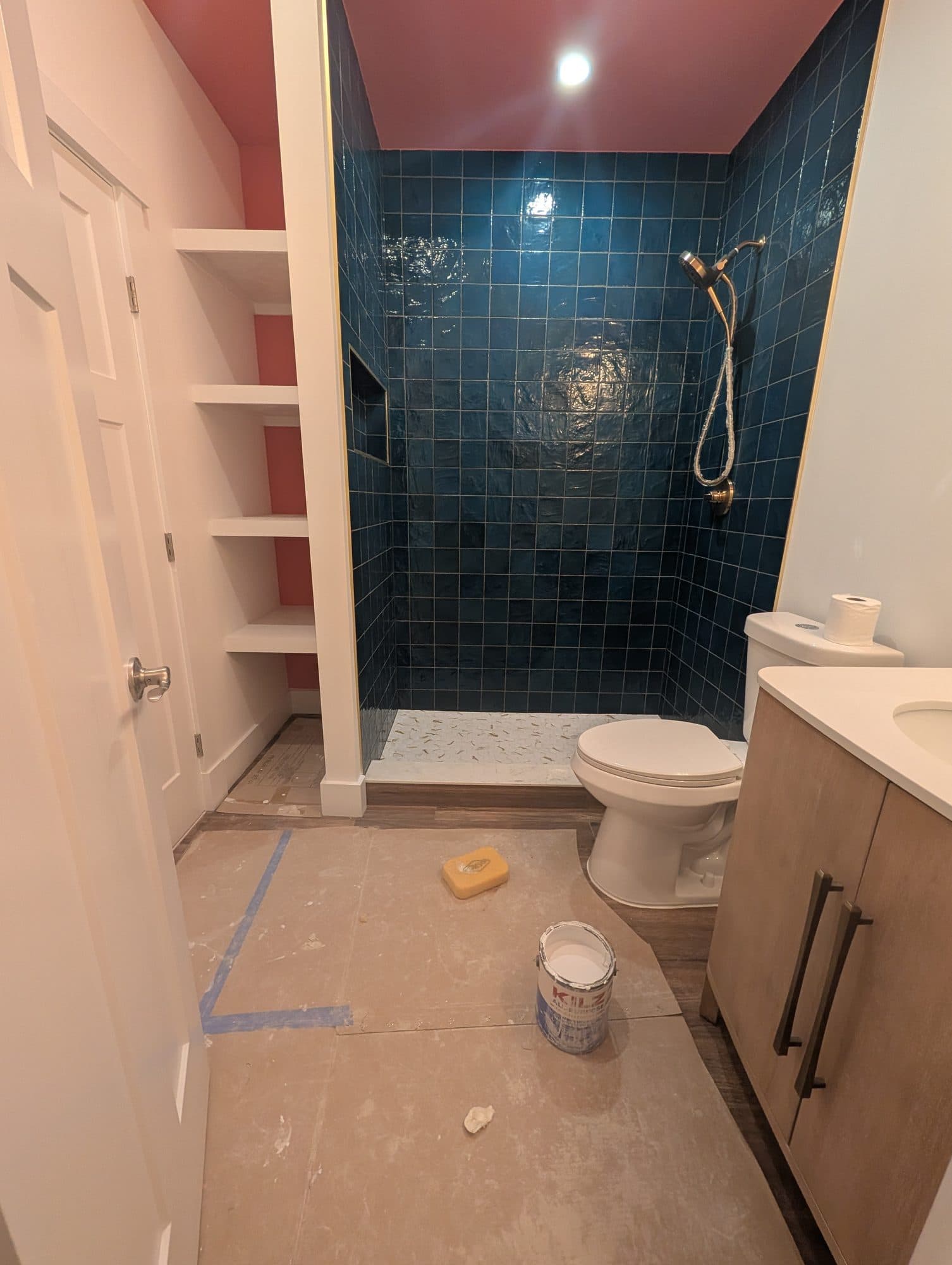Bathroom with a clean blue tile walk-in shower